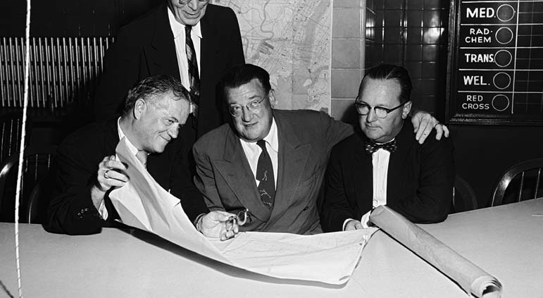 shown with Jersey City officials, announced that, in 1956 through 1958, the Dodgers would play seven games each season in Jersey City and would have the option to continue the agreement for three years beyond that.