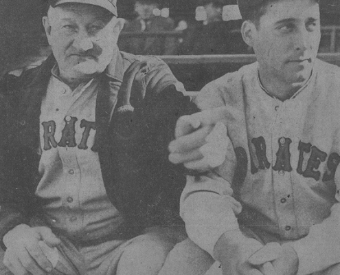 gives Johnny Rizzo (right), a promising Pittsburgh outfielder purchased from Columbus, a few pointers during an exhibition game.