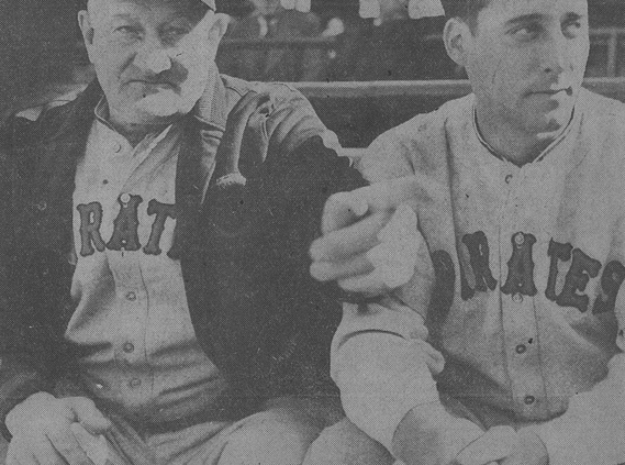 gives Johnny Rizzo (right), a promising Pittsburgh outfielder purchased from Columbus, a few pointers during an exhibition game.