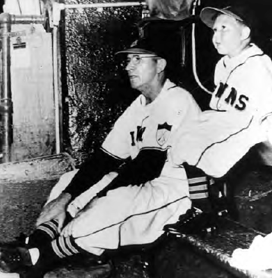 with manager Zack Taylor on the St. Louis Browns’ bench in 1951.