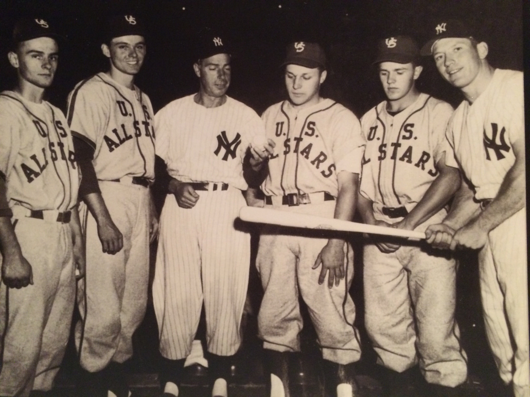 At the 1957 Hearst Sandlot Classic, Mickey Mantle and Joe DiMaggio partook in a pre-game home run hitting contest with Willie Mays. The boys between DiMaggio and Mantle are Thomas Hollman and Frank Heinicke of Pittsburgh. (PHOTO COURTESY OF CHRIS HOLLMAN)