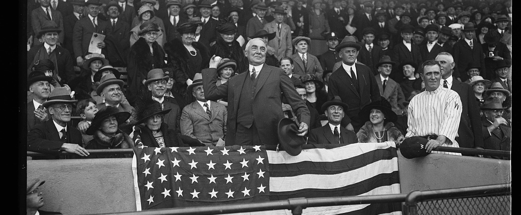 President Warren G. Harding, center, throws out the ceremonial first pitch before a Washington Senators game on April 13, 1921, at Griffith Stadium in Washington, DC. (LIBRARY OF CONGRESS, NATIONAL PHOTO COMPANY)