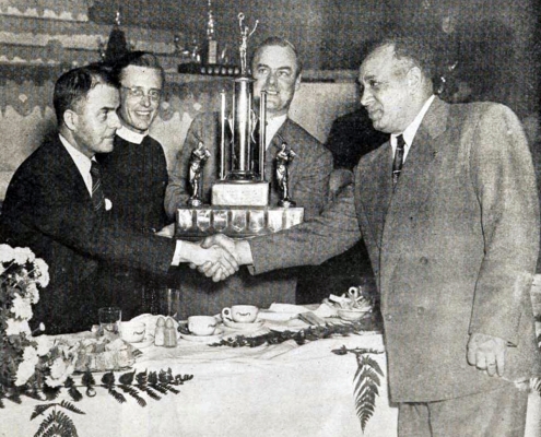Charlie Culver, right, is honored as manager of the 1950 Montreal junior champions.