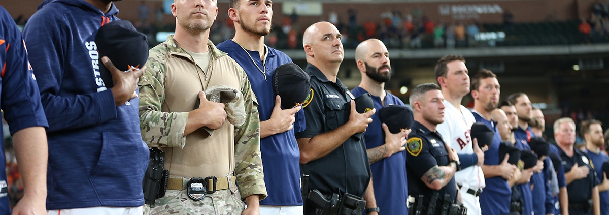Houston Astros players stand with first responders in the team's first game since Hurricane Harvey on September 2, 2017, at Minute Maid Park in Houston. (COURTESY OF THE HOUSTON ASTROS)