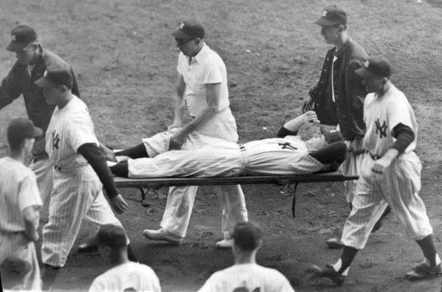 Mickey Mantle is carried off on a stretcher after injuring his knee during the 1951 World Series at Yankee Stadium. (NATIONAL BASEBALL HALL OF FAME LIBRARY)