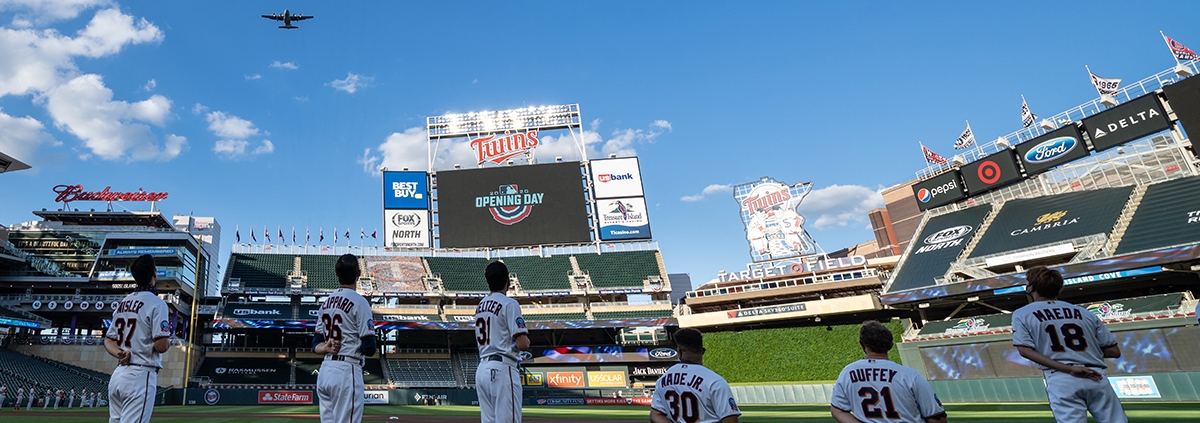 Minnesota Twins players LaMonte Wade and Tyler Duffey, center, kneel during the national anthem in a protest for racial justice on July 28, 2020, at Target Field in Minneapolis. (COURTESY OF THE MINNESOTA TWINS)