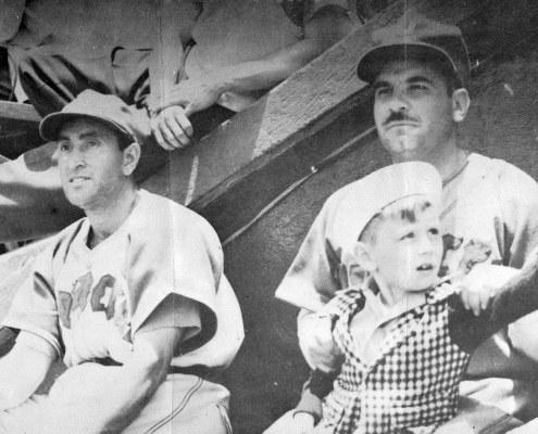 Mexican League executive Jorge Pasquel, right, sits with the son of catcher Mickey Owen on his lap and outfielder Danny Gardella, left, during a 1946 game in Veracruz, Mexico. (SABR/Rucker Archive)