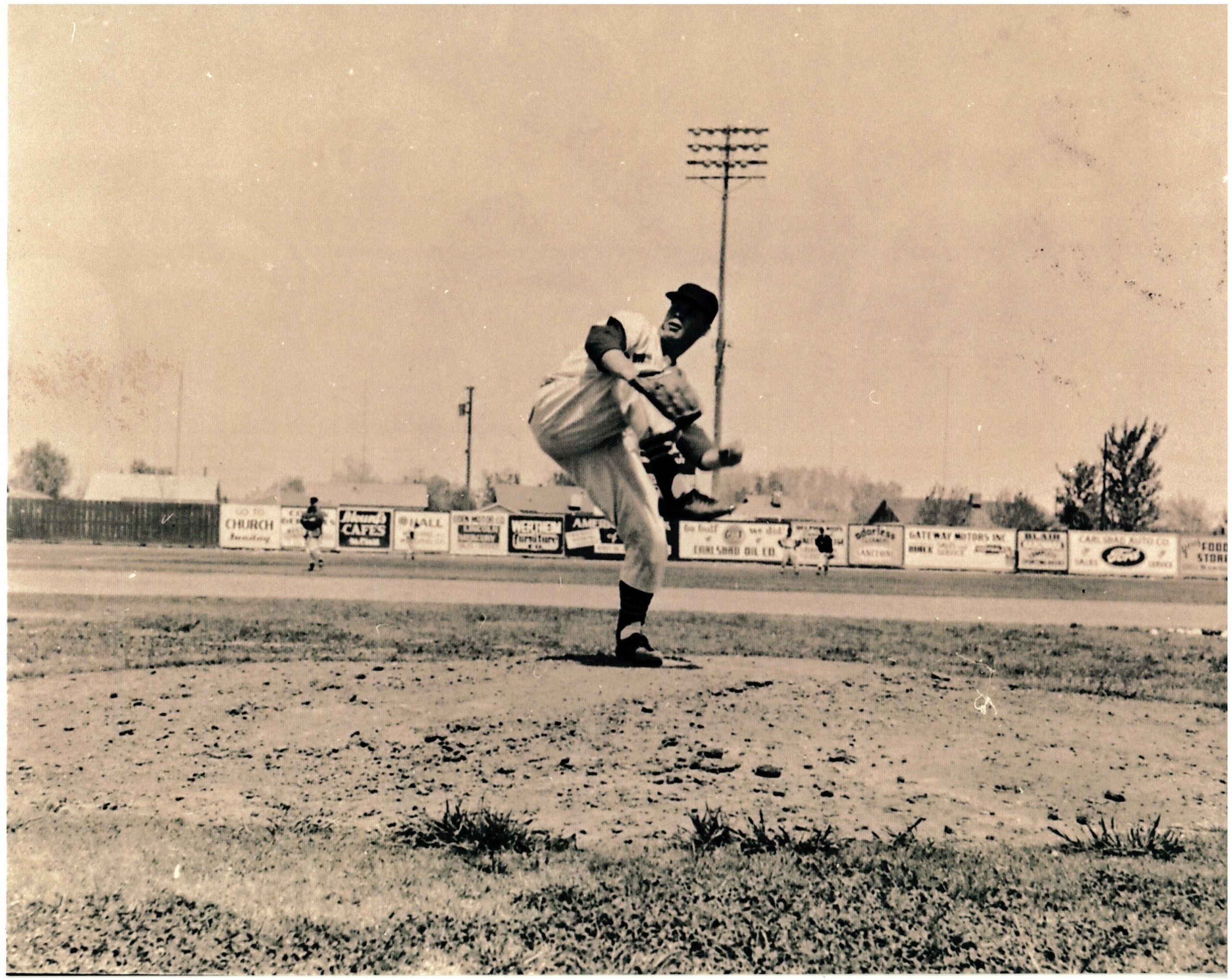 Pitcher Gordon Zabasky winds up on the mound at Montgomery Field, April 1957 (Courtesy of Near Loving's Bend Photo Archives | www.senmhs.org)