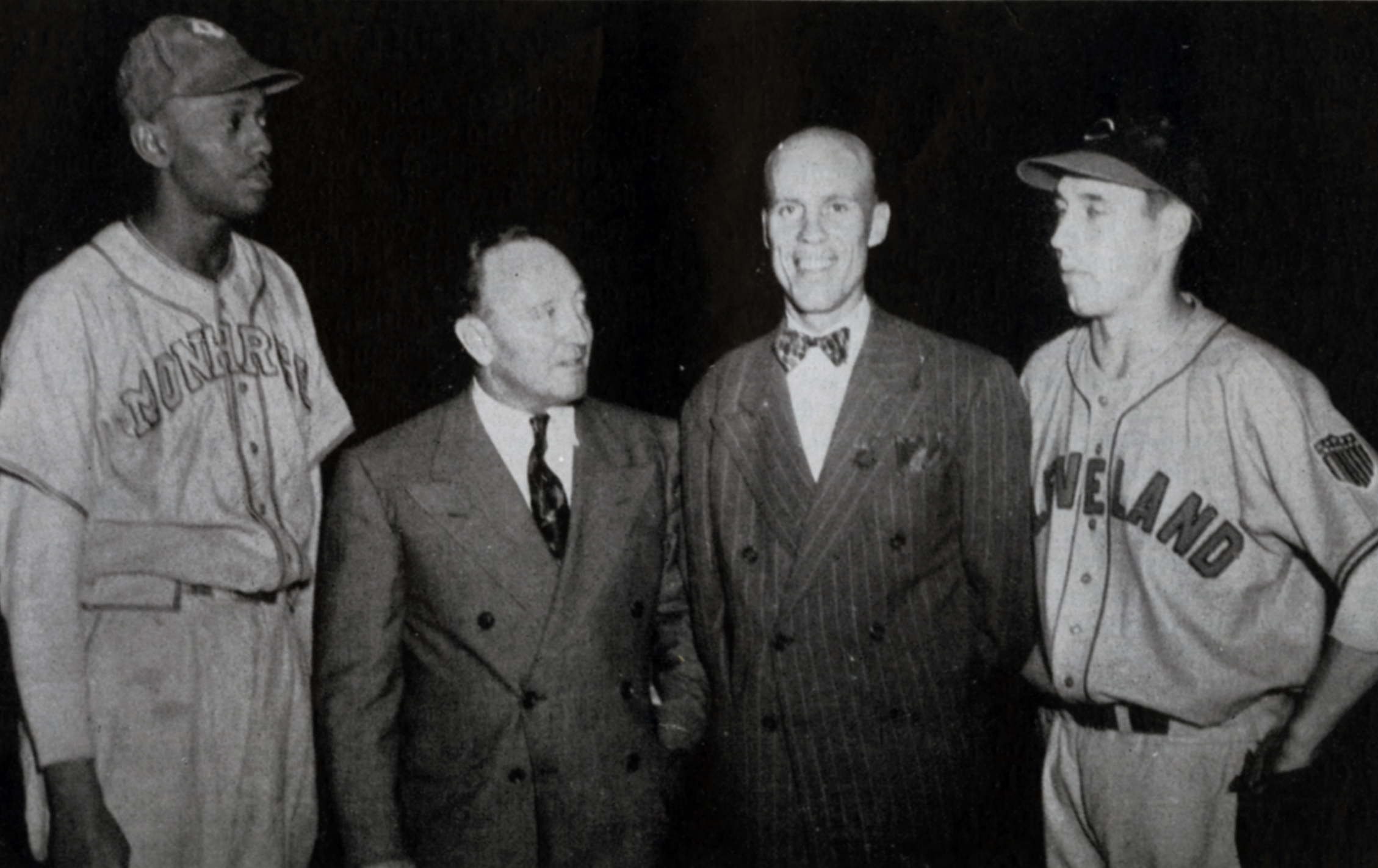 From left, Negro Leagues star Satchel Paige, broadcaster and future manager Fred Haney, outfielder Pete Gray, and Cleveland Indians ace Bob Feller pose for a photo in Los Angeles, where more than 20,000 fans watched Feller’s all-star team beat Paige’s team in a postseason exhibition in 1946. (SABR-RUCKER ARCHIVE)