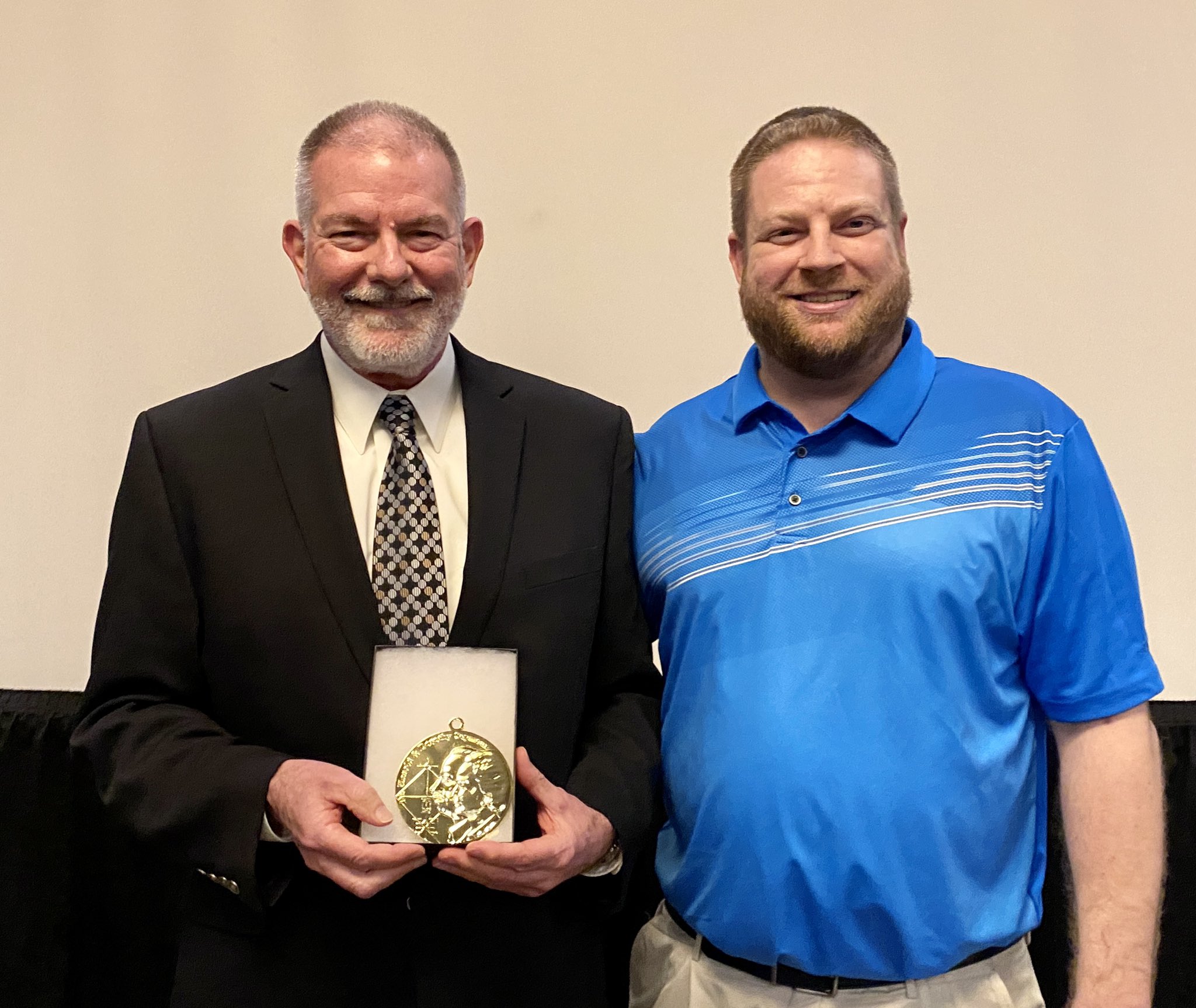 2022 Seymour Medal winner Steven Treder, left, received his award during the 29th annual NINE Spring Training Conference on Saturday, March 5, in Tempe, Arizona. The medal was presented by SABR's Jacob Pomrenke. (Photo: Tracy Greer)