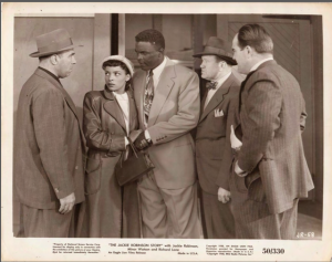 A publicity photo from The Jackie Robinson Story, featuring Robinson and co-star Ruby Dee.