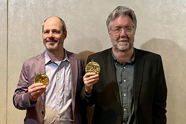 Dan Levitt, left, and Mark Armour receive their 2023 SABR Seymour Medal during the NINE Spring Training Conference on March 4, 2023, in Tempe, Arizona.