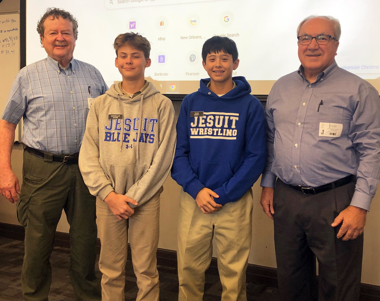 From left to right, Richard Dempsey, Marcellus Savoie, Davis Hebert, and Richard Cuicchi are pictured in May 2023. Savoie and Hebert are students at Jesuit High School in New Orleans who received scholarship awards in a baseball essay contest established by the local SABR chapter.