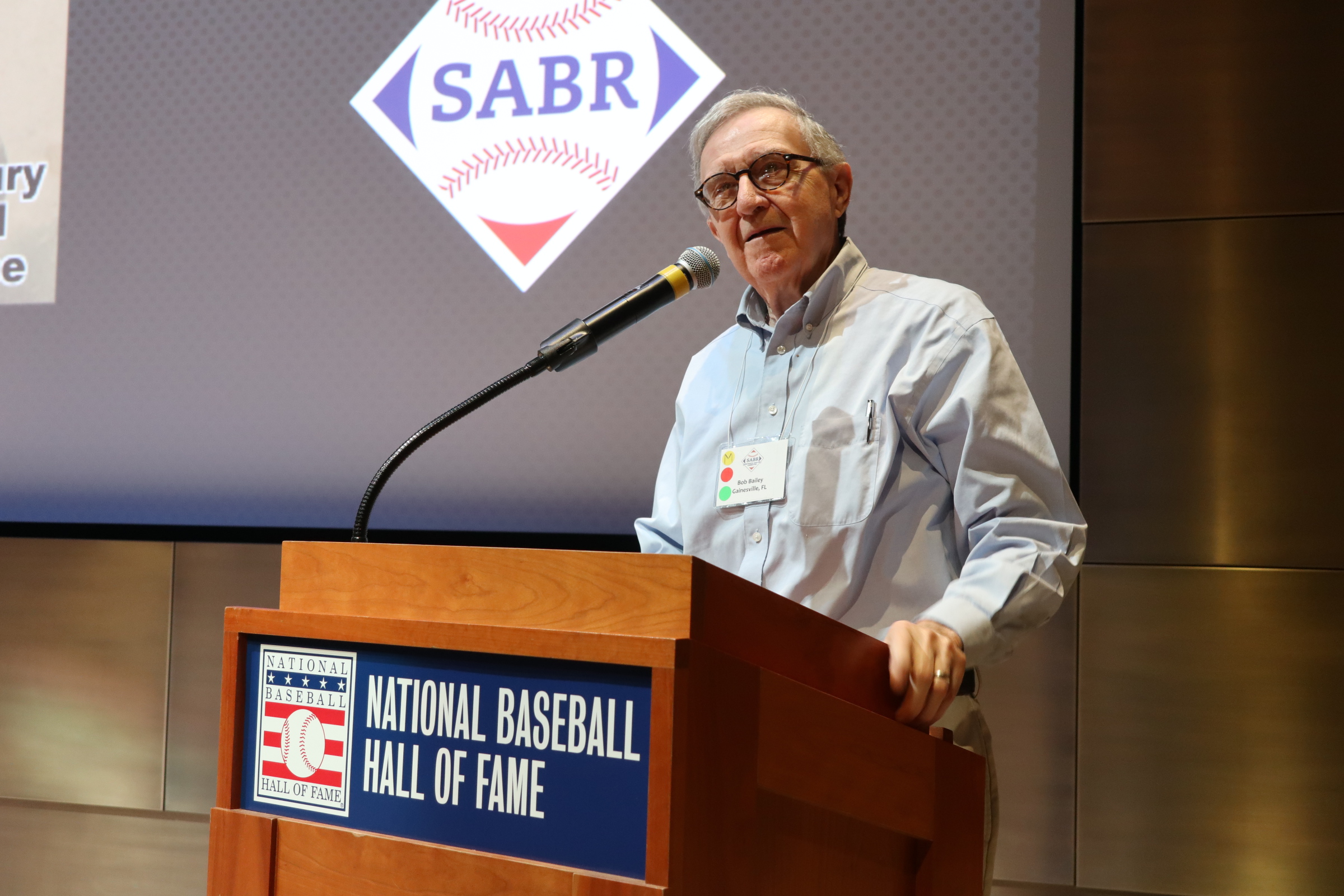SABR's Bob Bailey speaks at a podium during the 2023 Frederick Ivor-Campbell 19th Century Conference at the Baseball Hall of Fame in Cooperstown. (Photo: Dixie Tourangeau)