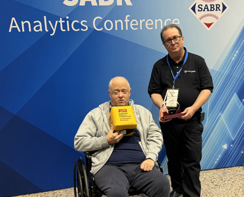 Baseball Prospectus founder Gary Huckabay, with friend and former colleague Keith Woolner, is presented with the 2024 SABR Analytics Conference Lifetime Achievement Award.