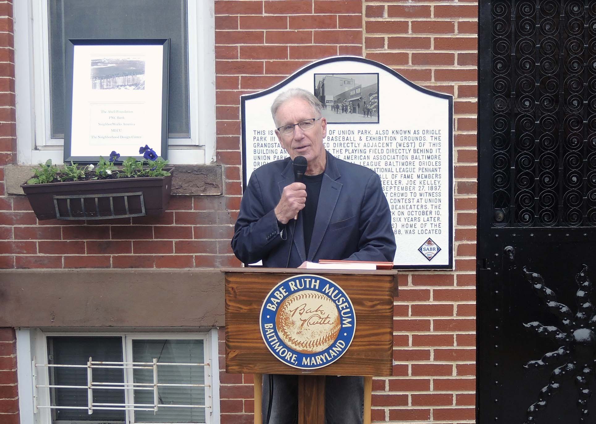 Michael Gibbons of the Babe Ruth Birthplace and Museum speaks during a dedication ceremony for a Union Park historical marker on April 19, 2024, in Baltimore, Maryland.