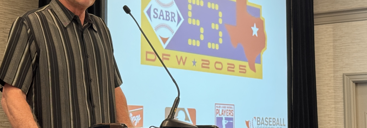 Bruce Bochy accepts the Roland Hemond Award at SABR 53 on June 26, 2025, in Irving, Texas.