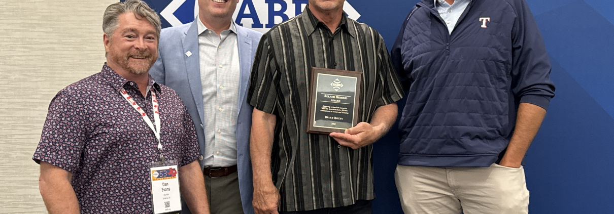 From left, SABR Board President Dan Evans, SABR CEO Scott Bush, Texas Rangers manager Bruce Bochy, and Rangers President of Baseball Operations Chris Young on June 26, 2025, at SABR 53 in Irving, Texas.