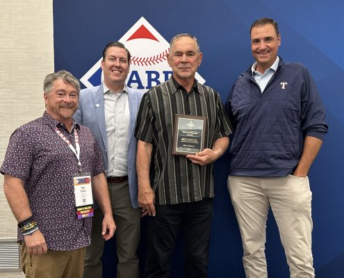 From left, SABR Board President Dan Evans, SABR CEO Scott Bush, Texas Rangers manager Bruce Bochy, and Rangers President of Baseball Operations Chris Young on June 26, 2025, at SABR 53 in Irving, Texas.