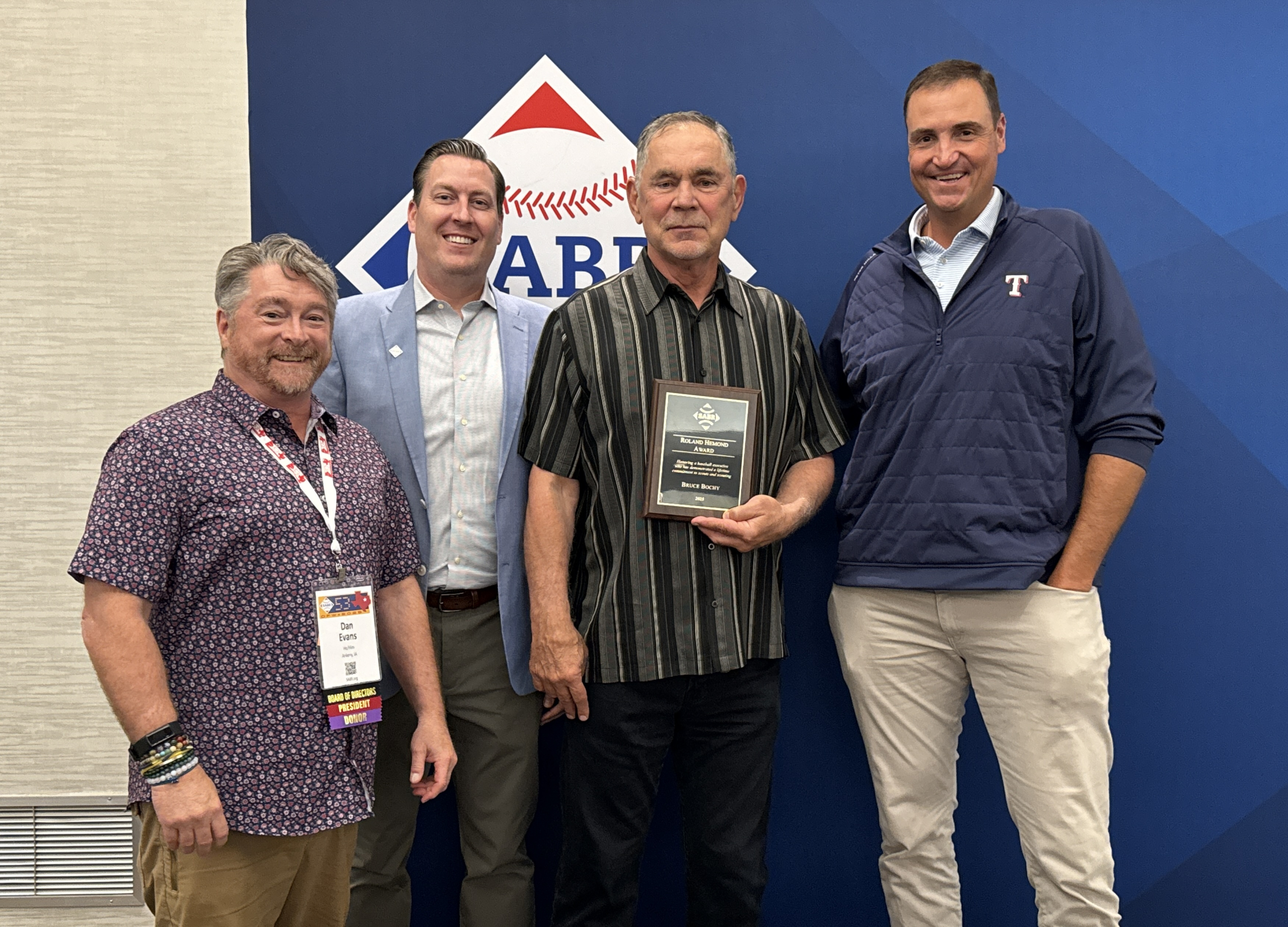From left, SABR Board President Dan Evans, SABR CEO Scott Bush, Texas Rangers manager Bruce Bochy, and Rangers President of Baseball Operations Chris Young on June 26, 2025, at SABR 53 in Irving, Texas.