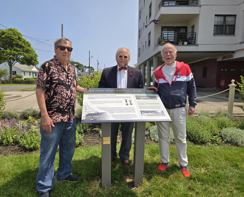 From left: Herb Crehan, Steve Greenberg, and Dennis Riley participate in a dedication ceremony on June 11, 2025, at a newly installed storyboard exhibit for the first night baseball game played in Hull, Massachusetts.