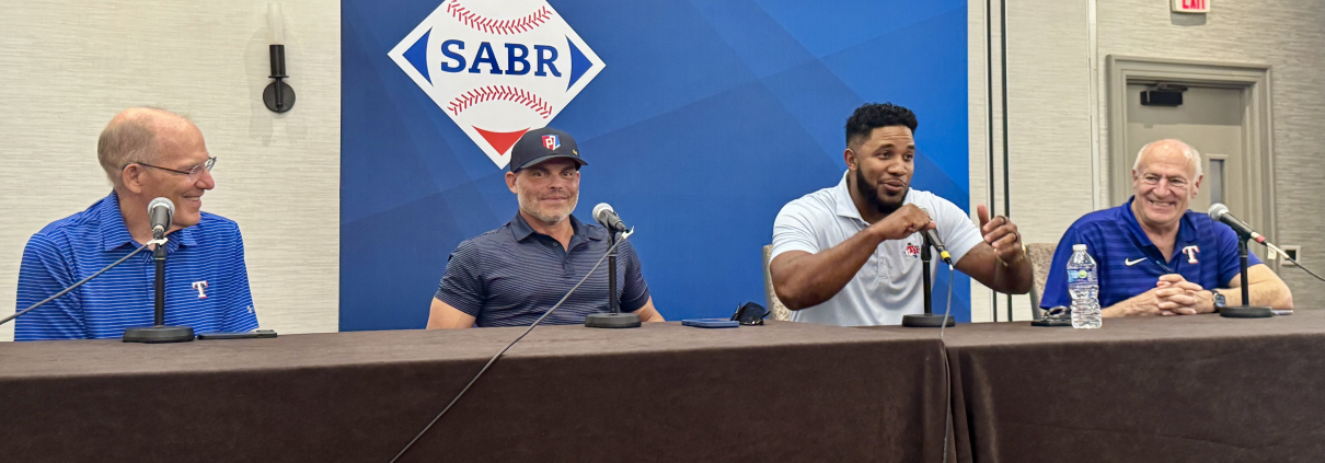 At SABR 53, the Texas Rangers Hitters Panel included, from left, Tom Grieve, Iván Rodríguez, Elvis Andrus, and moderator Eric Nadel on June 26, 2025, in Irving, Texas.